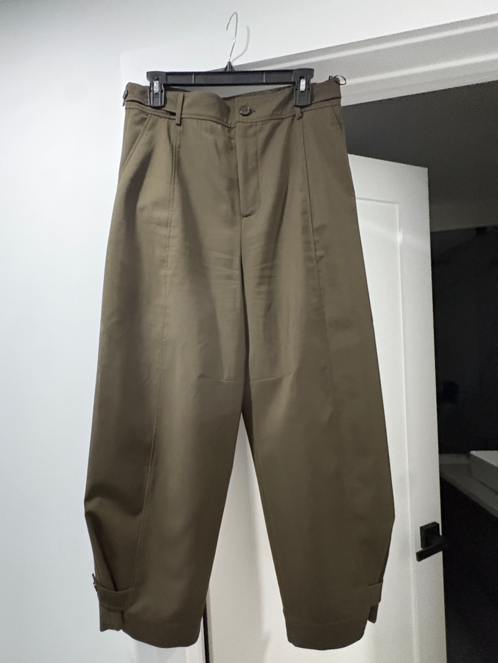 Dark Olive Green pants. Adjustable waste and bottom. Side slit picks.